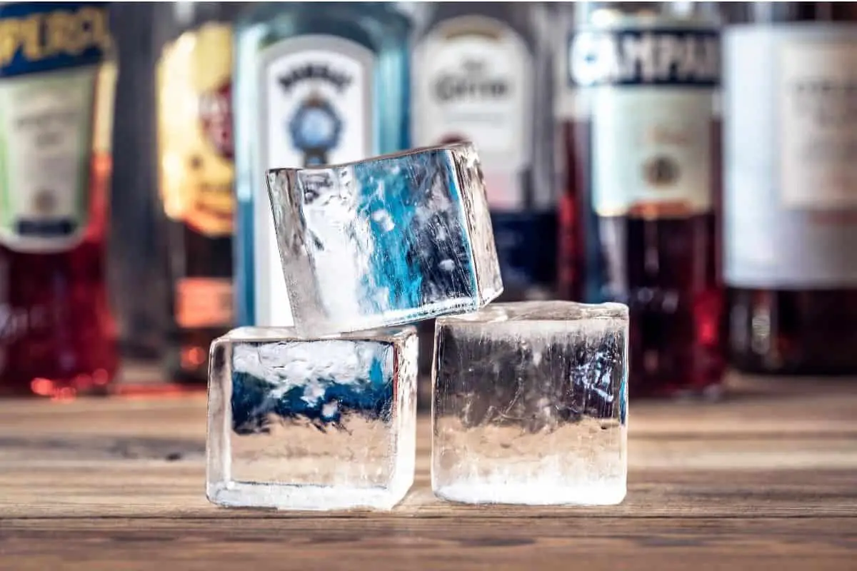 3 crystal clear ice cubes are stacked on top of each other representing how to make clear ice at home